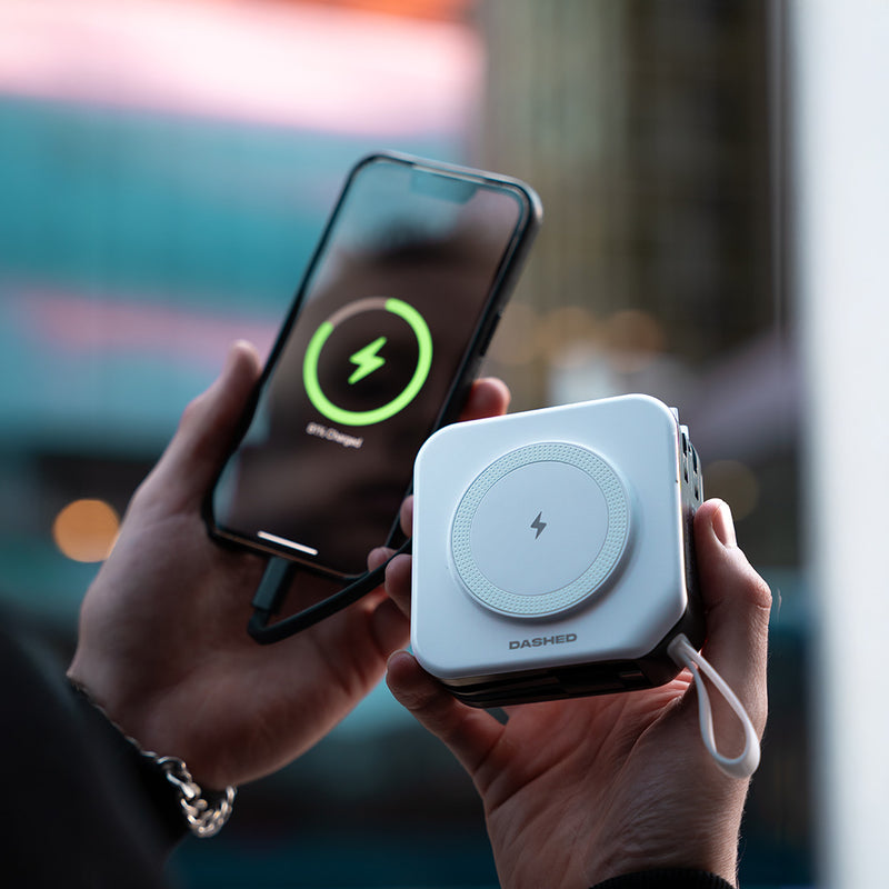 White TravelPod next to iphone charging