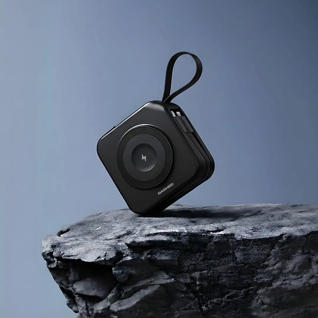 Black travel charger with wireless charging pad. 